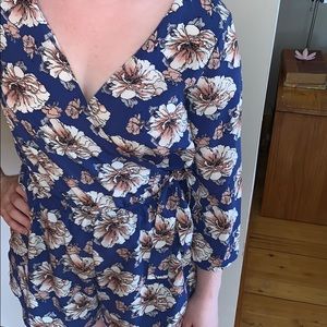 Blue romper with floral detail